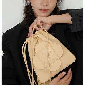 Designer leather flower mini crossbody bag by Yee Si